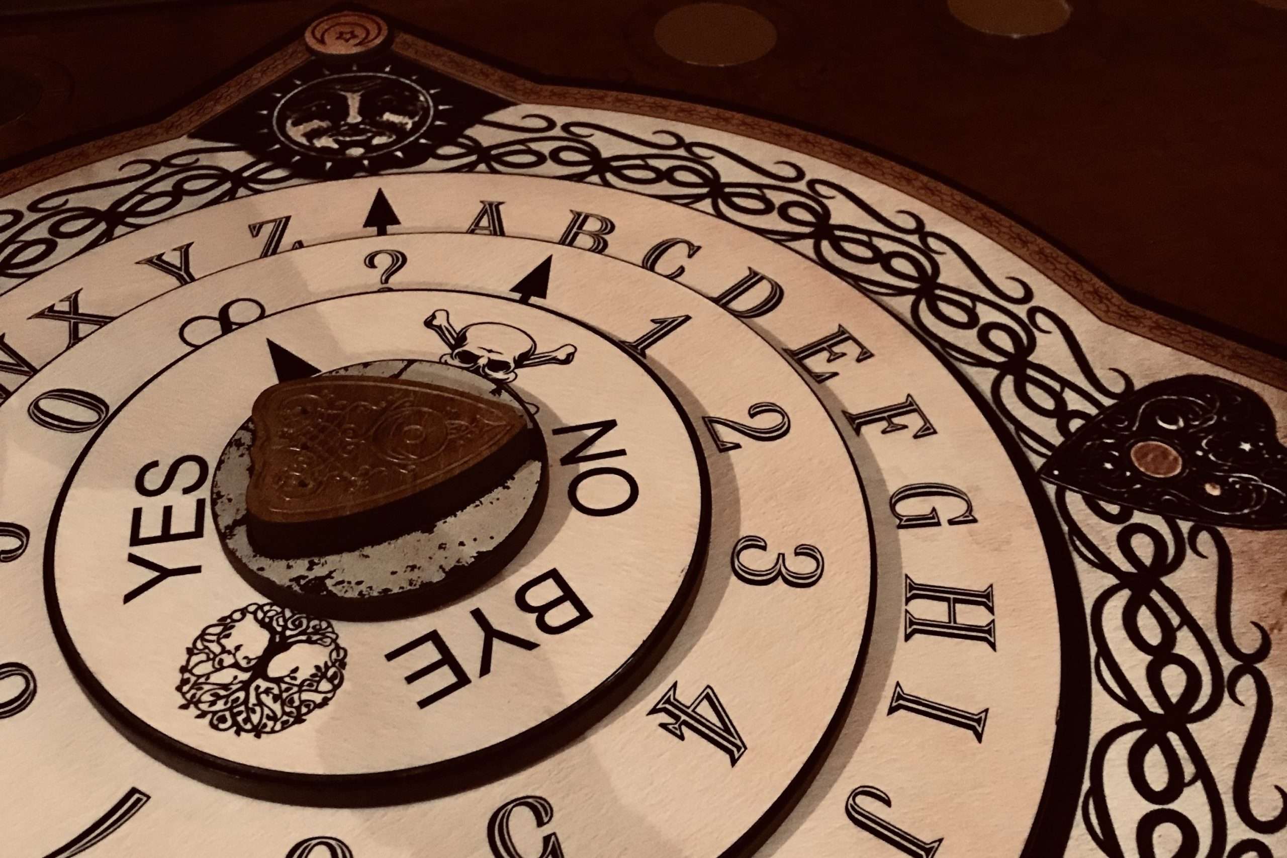 Ouija board in the Paranormal Mystery of Breckenridge Escape Room at Mountain Time Escape Rooms in Breckenridge