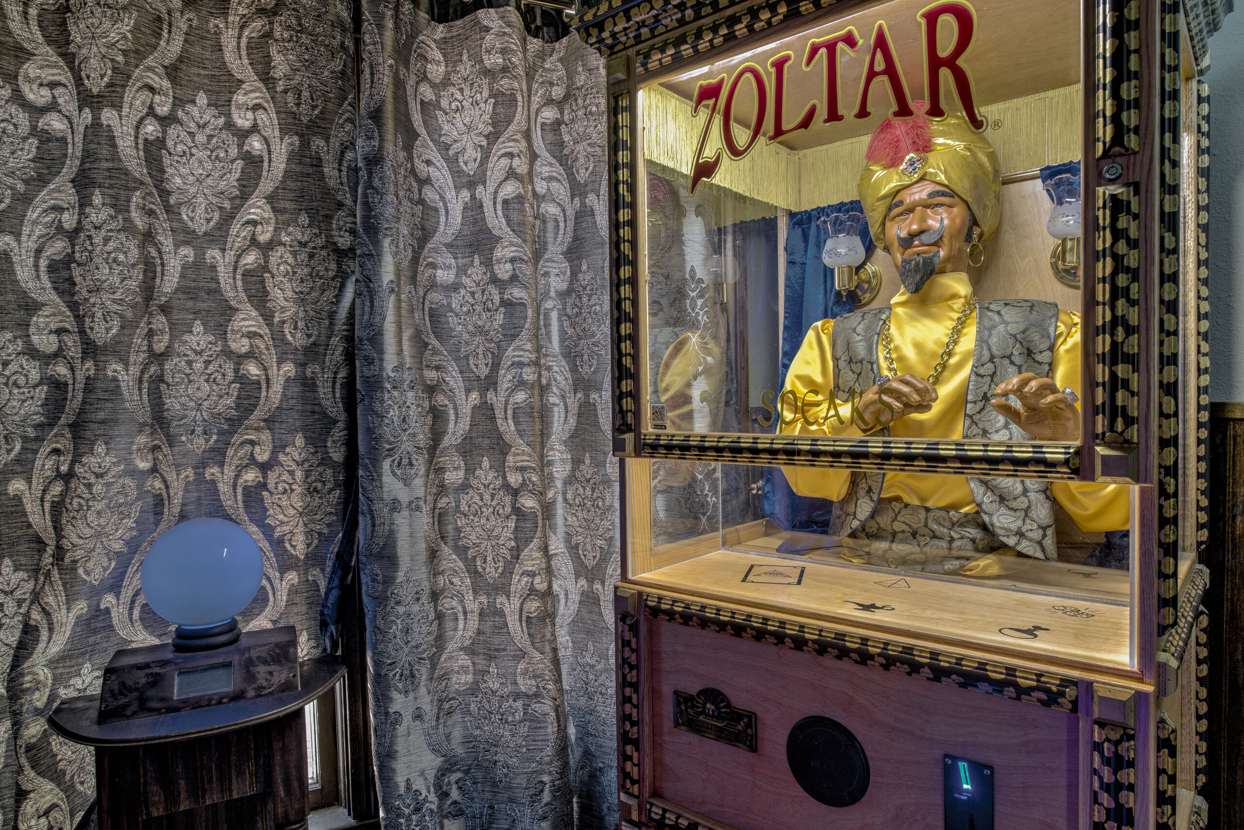 Zoltar machine and crystal ball in the Zoltar Speaks Escape Room at Mountain Time Escape Rooms in Breckenridge, CO